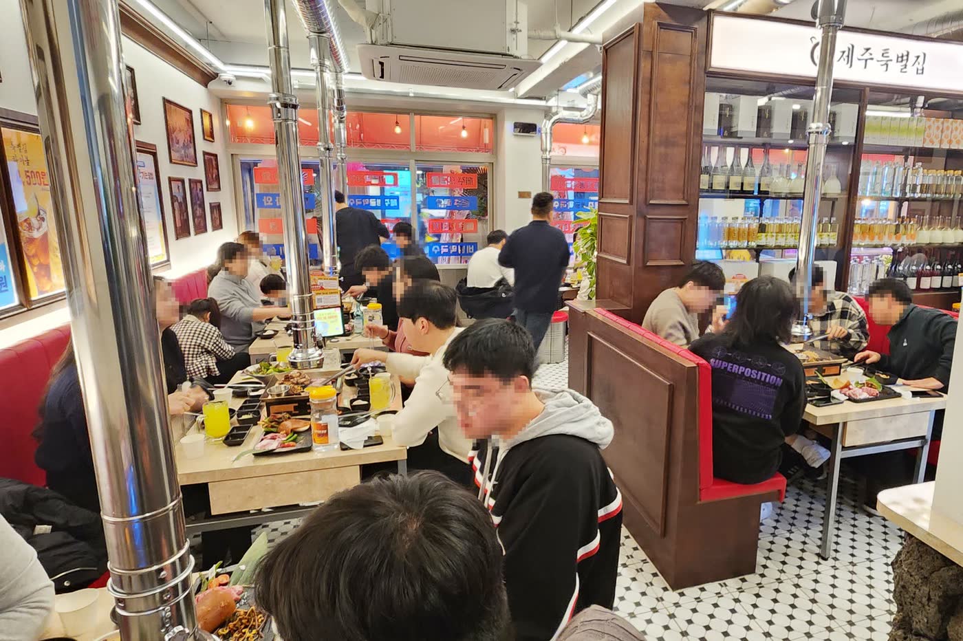 제주특별집 홍대점 매장 3 — Jeju Special House Korean BBQ restaurant in Hongdae, Seoul (storefront, interior and dining room)